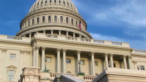 Camera-Pans-Up-From-Steps-Of-Us-Capitol-Building-In-Washington-Dc-To-Its-Landmark-Dome-And-Castiron-Freedom-Statue-On-Top