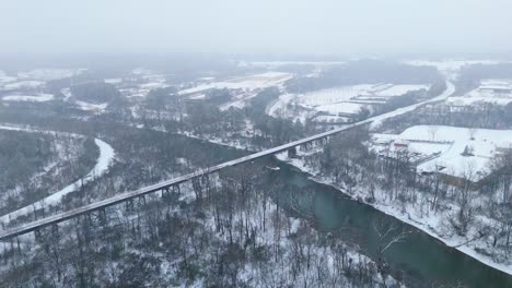 static aerial shot of the snow covered chattahoochee river and national park in atlanta, georgia on january 10th 2025.