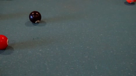 a shot of the cue ball making the breaking shot in pool