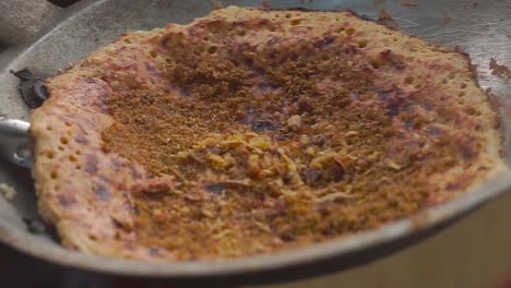 sprinkling of spices and fried shallots in kerak telor