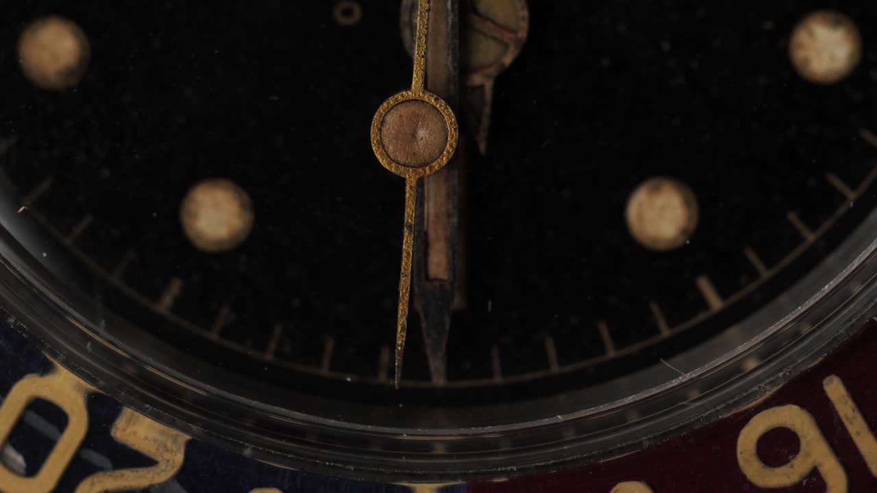 Macro shot of the moving second hand on a vintage wrist watch