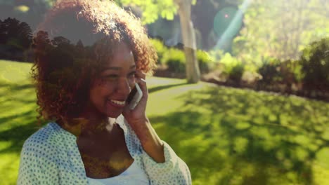 Woman-calling-on-her-phone-while-smiling-and-giggling-4k