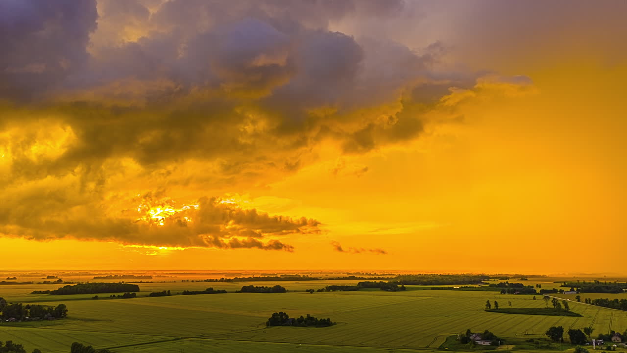 Sunset Time-lapse. Movement Of Clouds Against The Yellow Golden Sky