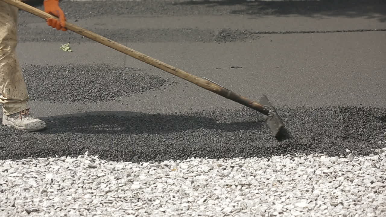 Construction workers during asphalting road works