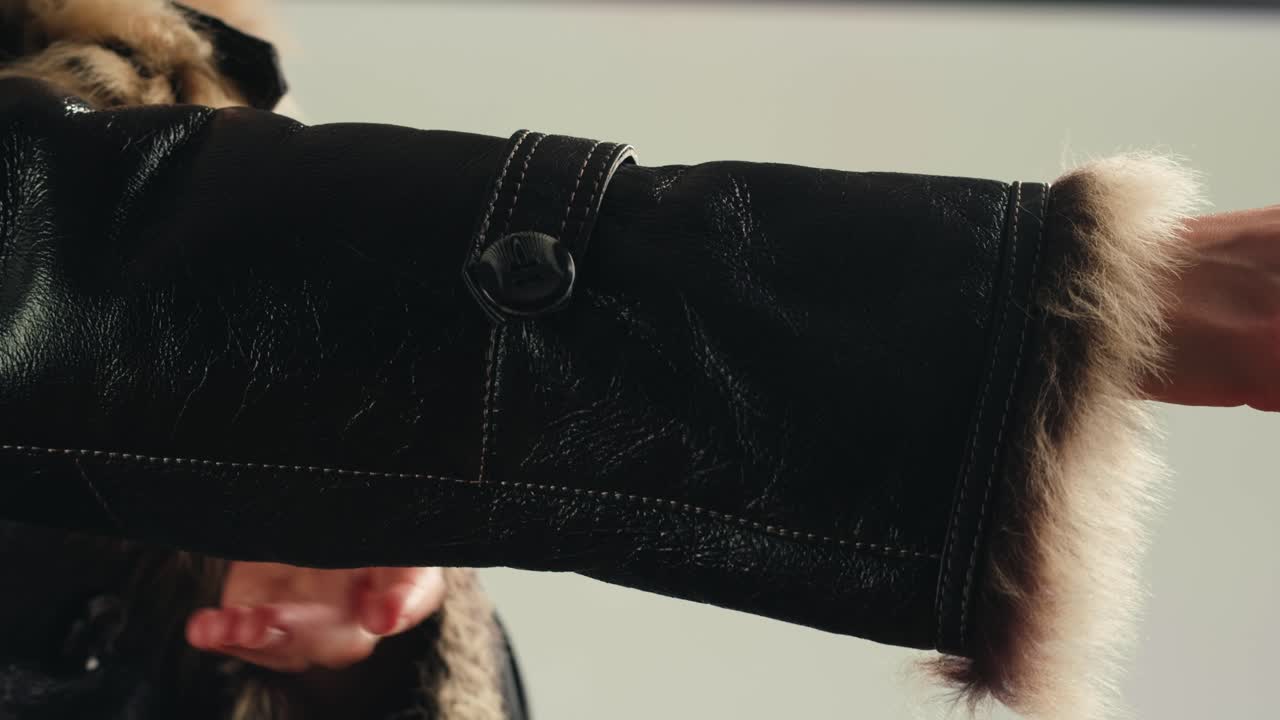 Close up of fur trimmed leather jacket