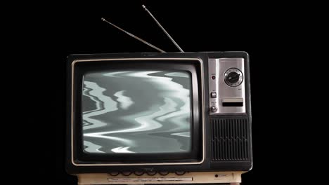 old television with green screen over black background. 4k resolution.