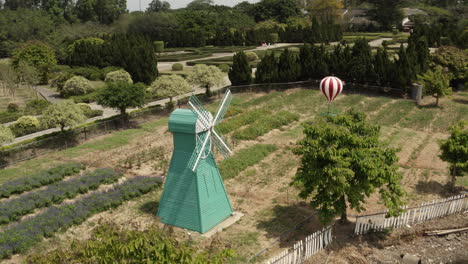 decorative holland style windmill in a formal park