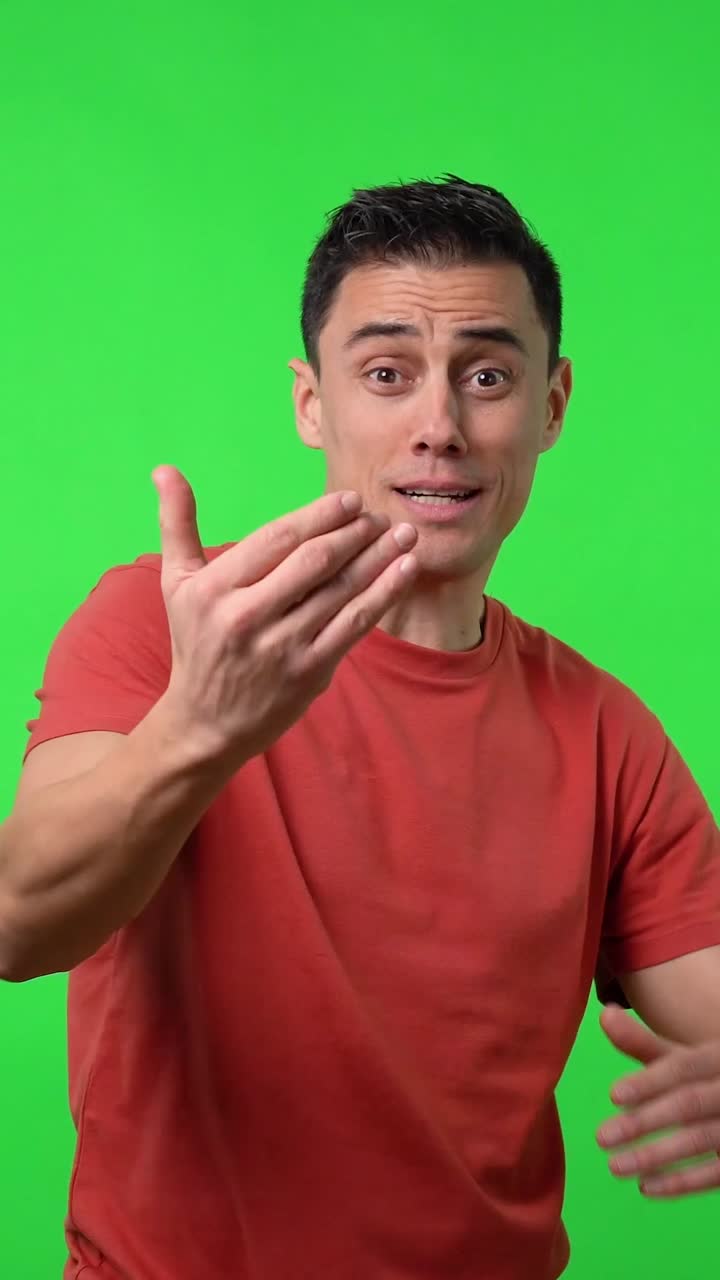 Man in red shirt with various expressions on green screen