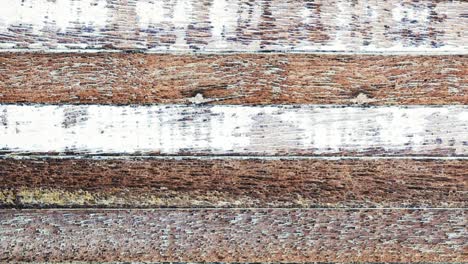 top view old wood texture distressed grunge background animated fast moving motion from right to left. 4k loop. scratched paint on wood wall texture with grain, abstract background for copy space.