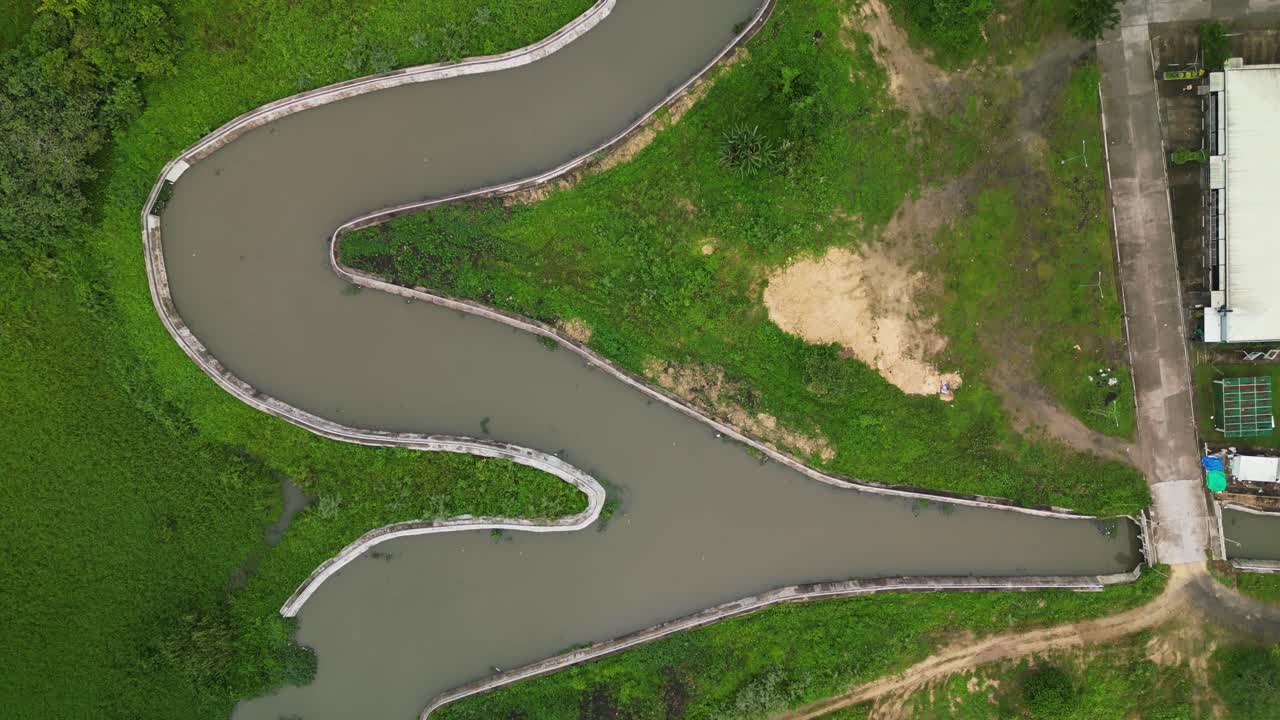 Above View Of A Winding River Stream In A Reservoir In Naga City, Camarines Sur, Philippines. Aerial Topdown Shot