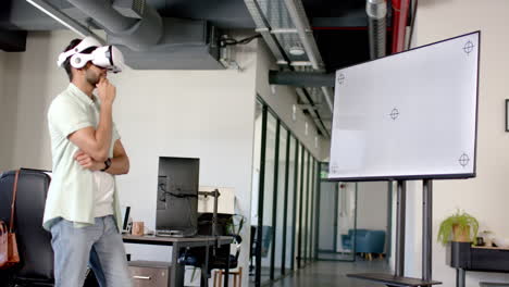 using vr headset, man analyzing data on screen in modern office, copy space
