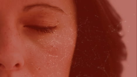 light connections moving on a red background with a women eye