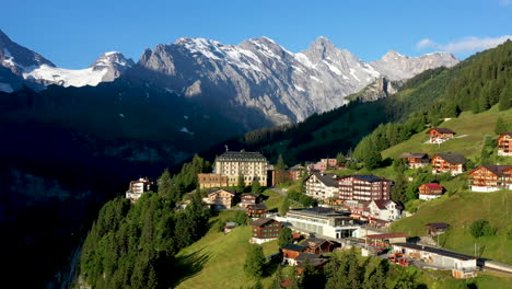 Cinematic-rotating-drone-shot-of-Murren,-a-traditional-Walser-mountain-village-in-the-Bernese-Highlands-of-Switzerland