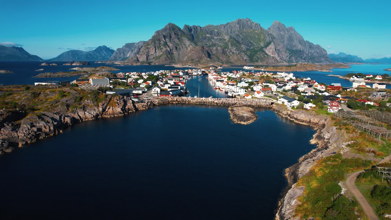 Lofoten coastline, Henningsvær village and its iconic football field and sea mountain rocks. Norway