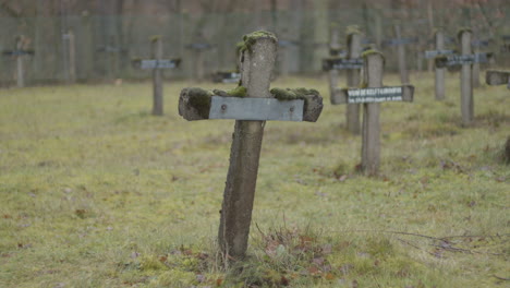 static shot of crooked crucifix at old cemetery