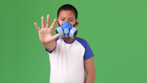 child wearing a pollution mask