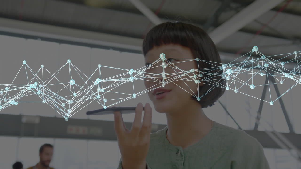 Woman speaking into smartphone with digital network connections overlay animation