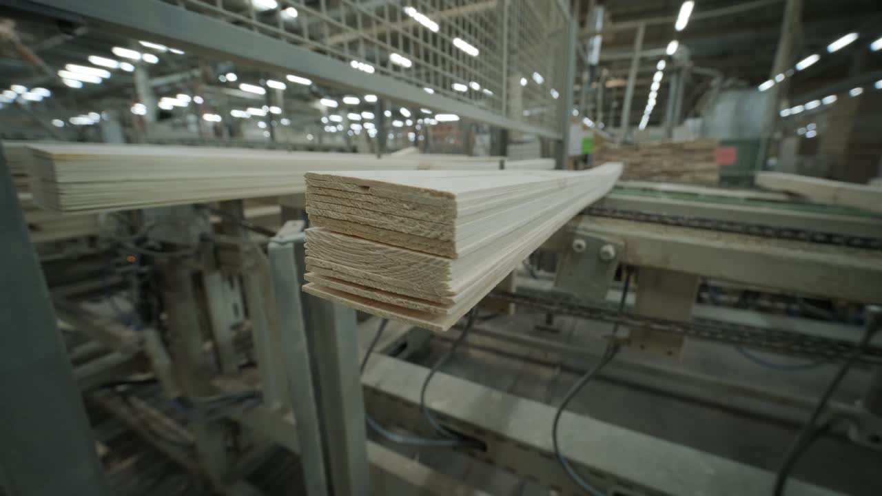 Wooden Planks Moving on Conveyor Belt in a Factory