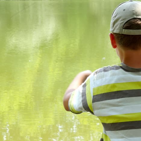 boy fishing nearby river
