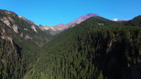 Aerial-view-above-the-Ravine-of-Nexpayantla-with-Popocatépetl-volcano-background,-in-sunny-Mexico