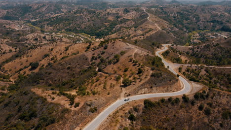 Truck-Driving-On-Mountain-Road-In-Algarve,-Portugal-At-Daytime