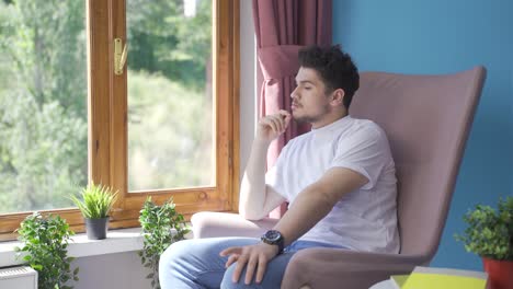 thoughtful and unhappy man at home.