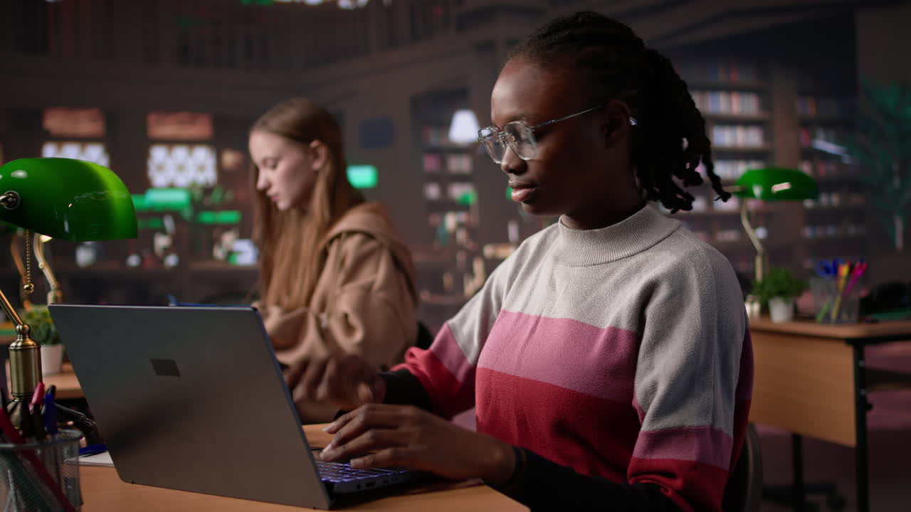 Vertical video african american girl comparing course notes with data from library collection