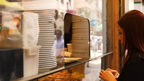 customer purchasing dessert at a bakery shop