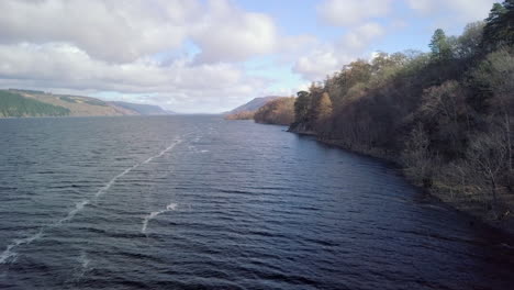 Aerial-footage-of-Loch-Ness-looking-towards-Inverness-on-a-sunny-day,-Scottish-Highlands,-Scotland