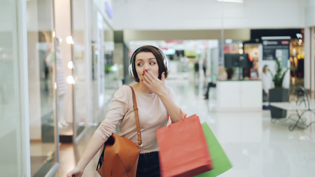 Happy Woman Shopping in a Mall