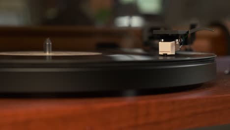 detail of a turntable needle with platter spinning low angle, slow motion 4k