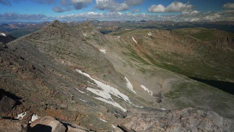 Cinematic-late-morning-view-Denver-top-of-Mount-Evans-Bierstadt-peak-snow-Summit-Echo-Chicago-lakes-14er-front-range-foothills-Rocky-Mountains-Idaho-Springs-wide-scenic-landscape-pan-to-the-right