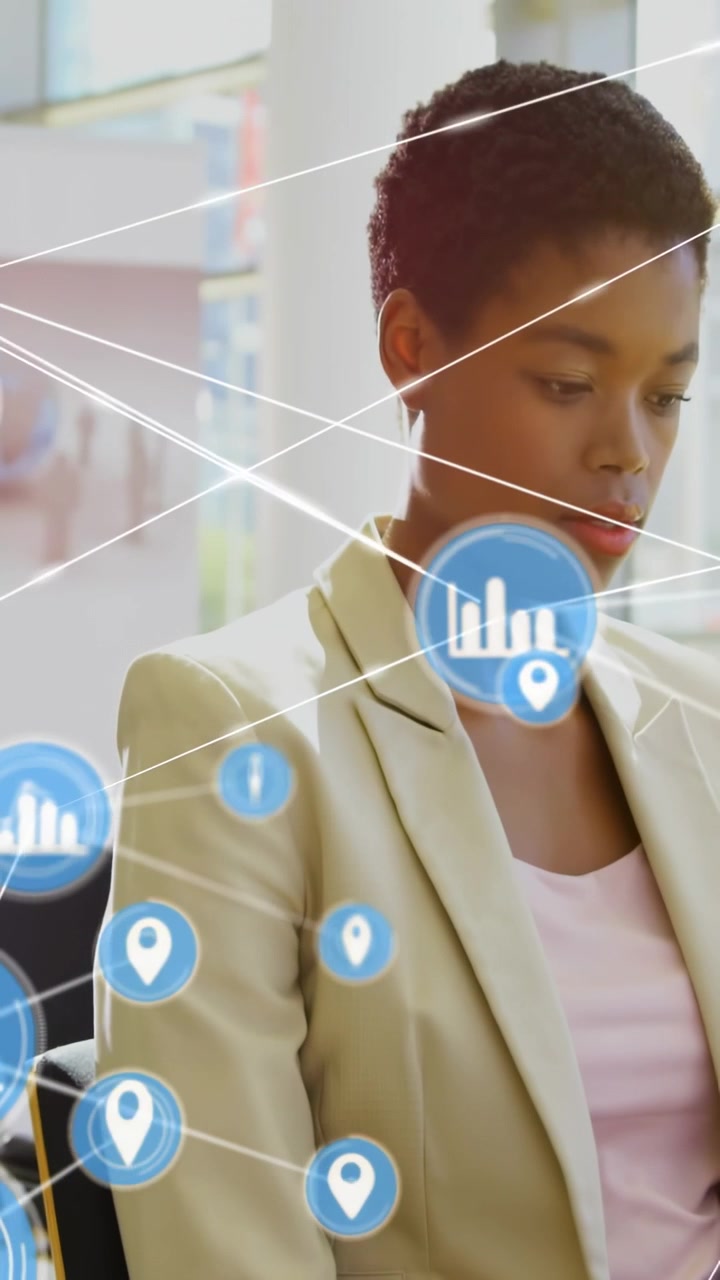 Vertical video: Woman sitting office icon appearing near torso linking graph icons showing tech
