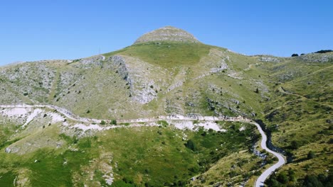 Aerial-shot-approaching-beautiful-mountain-peak-in-summer