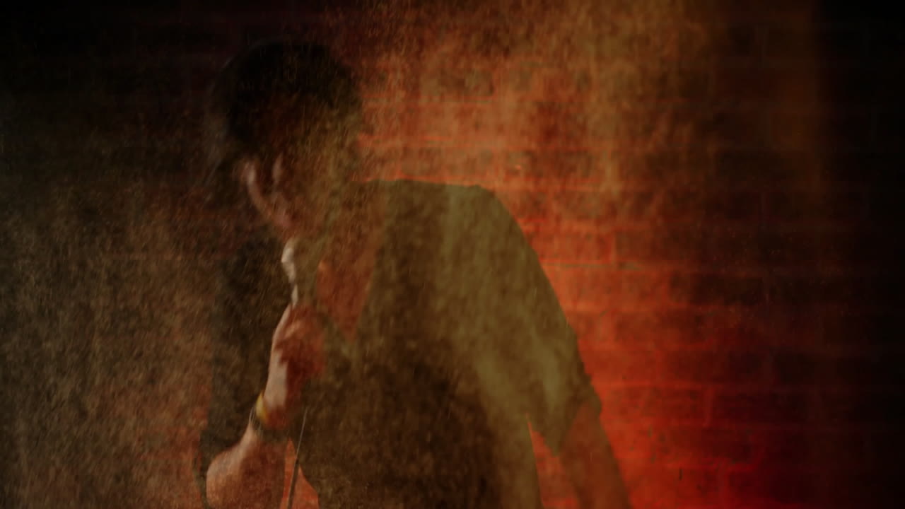 Male singer gripping mic in music show on brick stage, haze swirling around animated sound waves