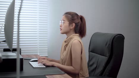 happy young woman freelance working at her home.