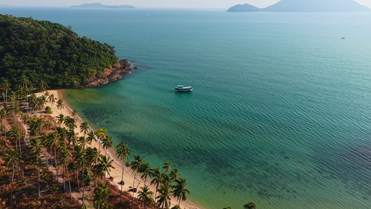 Tropical Beach with Palm Trees and Boat in Clear Turquoise Water