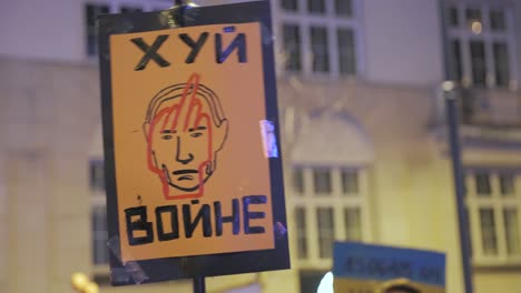 2022 russia invasion of ukraine - poster "fuck with war" at an anti-war demonstration in warsaw on the very first day of the war