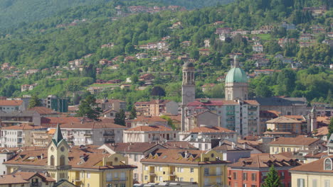 aerial tracking shot of italian town verbania in lago maggiore