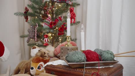 cozy christmas corner with festive tree and knitting setup