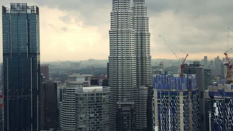 star residences buildings under construction beside petronas twin towers, kuala lumpur