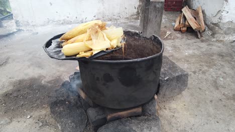 boiling corn on the cob outdoors