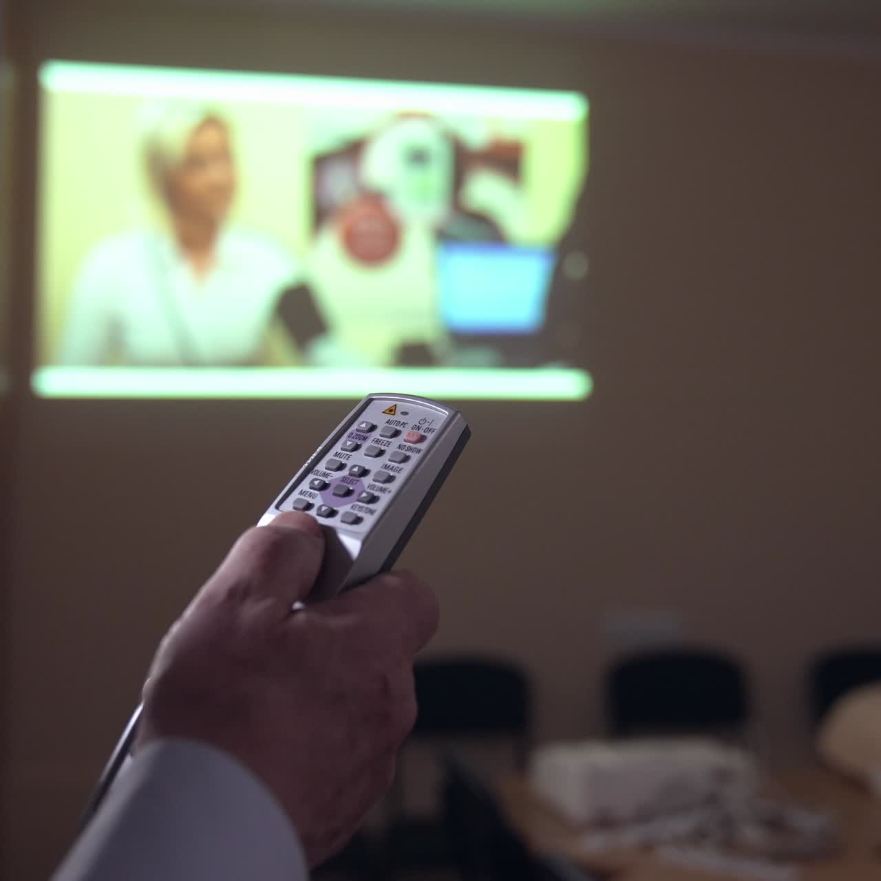 Medic in training center. Mannequin and medical equipment on a table. Instructor preparing to explaining the reanimation procedure near the doll model
