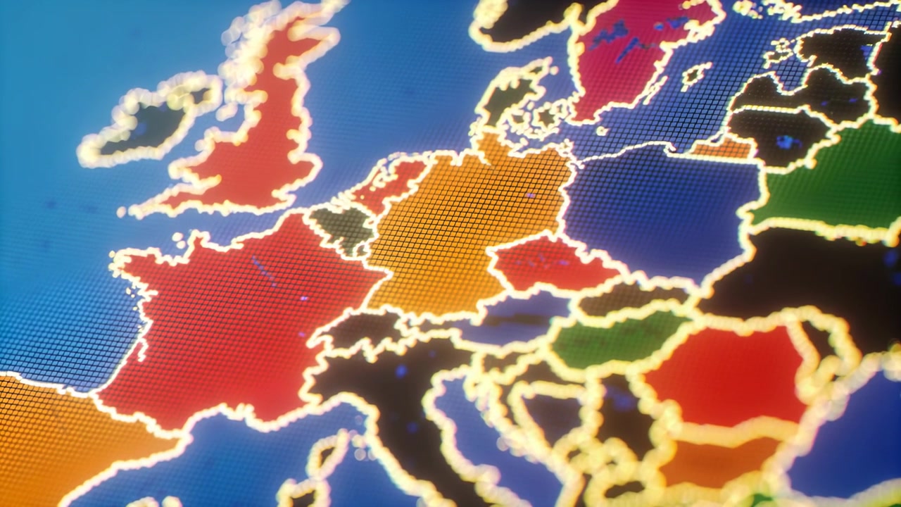 La telecamera si allontana, rivelando una mappa illuminata dell'Europa su uno schermo da studio, che mostra confini illuminati e una texture puntinata.