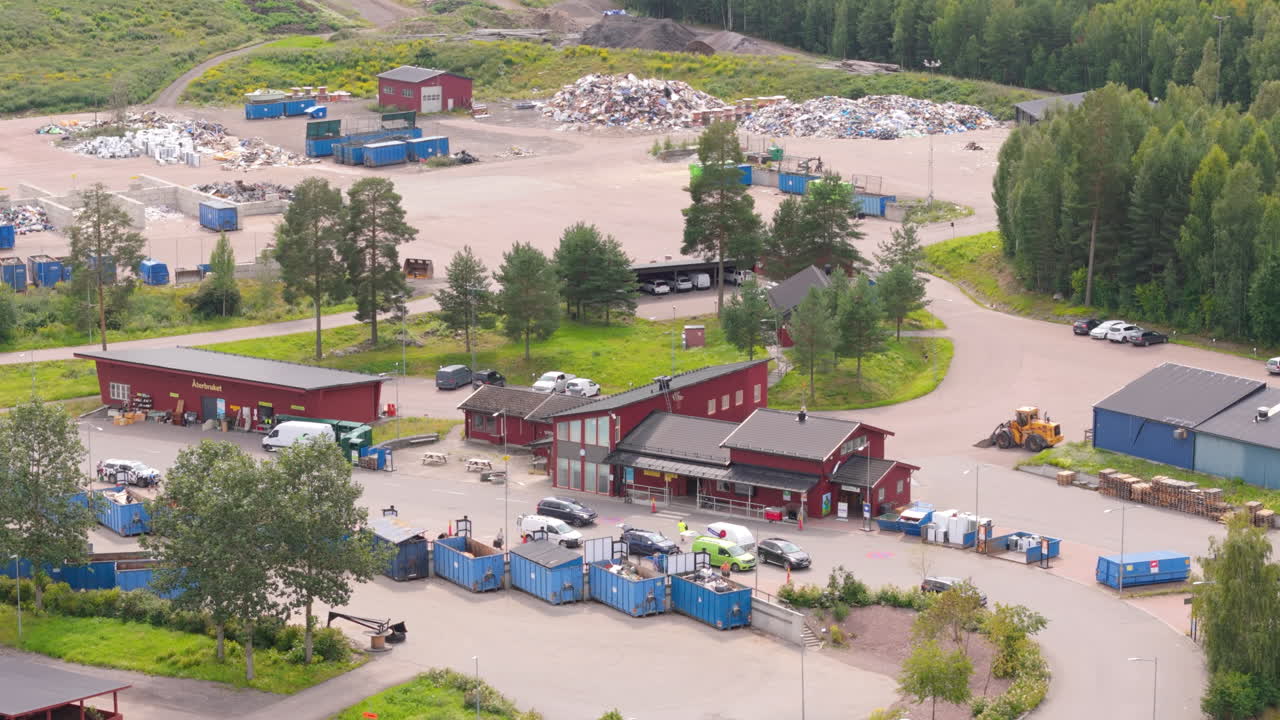 Residents drop household recyclable materials at Falun Recycling Centre, aerial