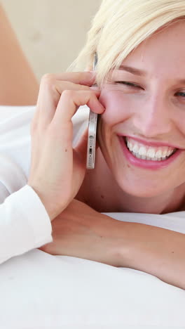 pretty blond woman phoning