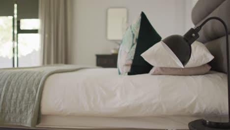 close up of bed and lamp in luxury bedroom