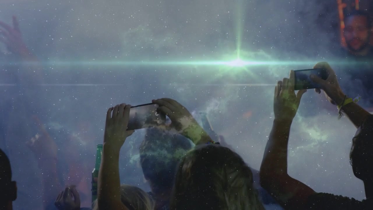 Music crowd raising phones and waving as performer rising, nebula sweeping flare lighting scene
