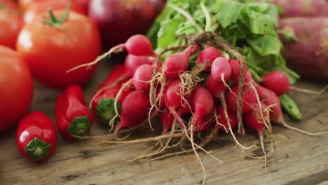 video of fresh fruit and vegetables over wooden background