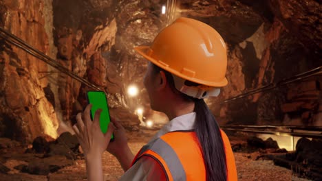 miner using a smartphone in a mine